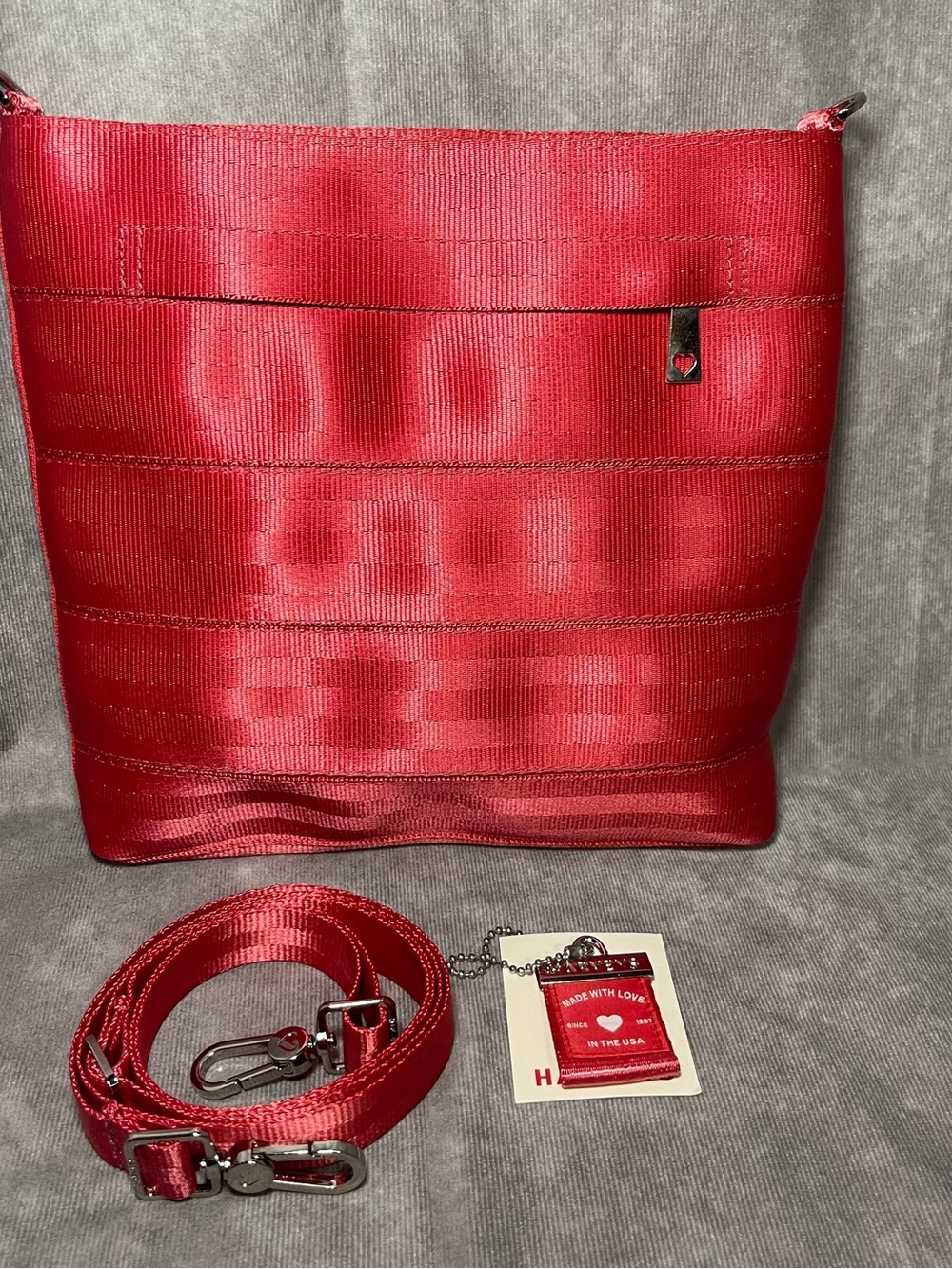 Harvey’s seatbelt grapefruit pink small streamline crossbody